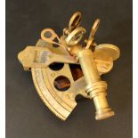 A bronze sextant with scale, glass lenses, adjustable, on the underside wooden grip, movable scale