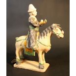 Chinese terracotta horse with rider; hand sculpted and partly cold painted and partly glazed; on