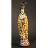 Chinese scultpure of a standing lady with flowers in hand; on wooden base; gilded copper with