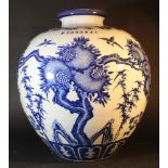 A large Chinese baluster vase with small neck and blue painted pomegranates and leaves on white