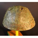 A bronze warrior helmet in Ancient style, made from four copper plates with connected copper