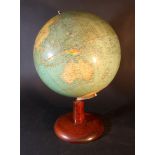 Terrestrial globe with political map, train and communication lines; cardboard with coloured printed