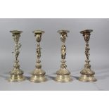 Four German silver candle sticks representing the four seasons; each with one spout, richly chased
