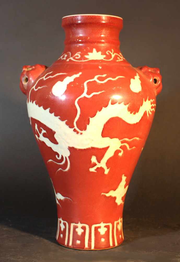 Chinese porcelain Baluster vase with red ground and white dragon, glazed; stepped neck; two hand - Image 2 of 3