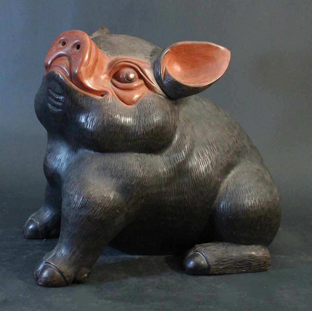 Chinese Yixing ceramic scultpure of a lucky pig; dark Yixing ceramic with some red parts; on the