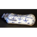 Chinese porcelain head rest in form of a bag, blue painted phoenix on white ground, glazed; in the