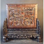 Small table paravent; two parts: the stand dark wood carved with flower decorations, the plate