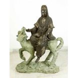 Large Asian bronze group of Guanyin sitting on a fabulous animal, on naturalistic style integrated