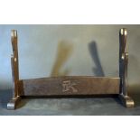 Japanese sword stand for two katanas; dark wood; on the connection bridge a symbol. height 30cm,