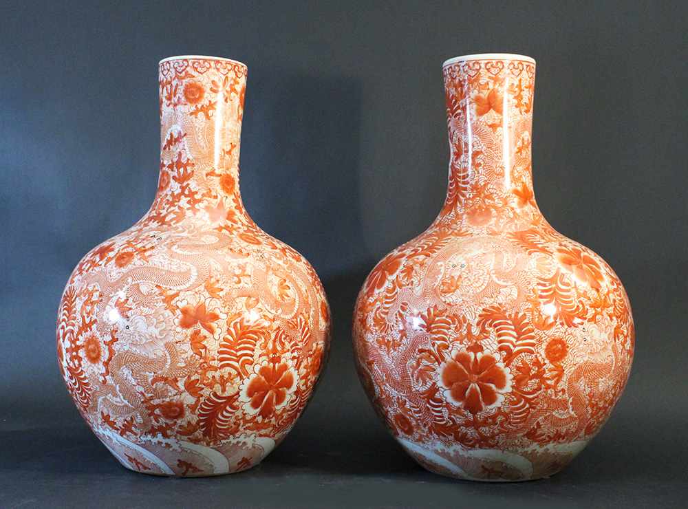 Chinese pair of porcelain vases; white ground with red painting of flowers and dragons; round form - Image 2 of 3