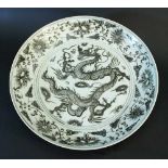 Chinese big porcelain salver, white ground with black painting of a dragon with pearl in the