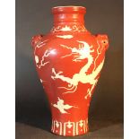 Chinese porcelain Baluster vase with red ground and white dragon, glazed; stepped neck; two hand