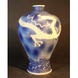 Chinese porcelain Meiping vase with very short neck; blue ground with white dragon, glazed; on the