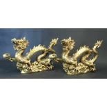 Pair of Chinese bronze gilded dragons, standing in a basis and stretching the right claw with a