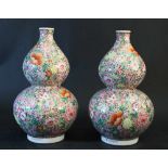 Pair of Chinese large pumpkin porcelain vases with thin neck, narrow middle section, rounded form on