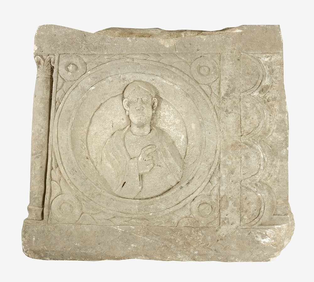 A Roman stone relief, quadratic plinth with sculpted central portrait of a man with stretched