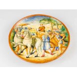An Urbino ceramic dish, round shape, in the centre a painted classical historical scene with a king,