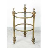 A small bronze Gueridon table on three column legs with chased deocrations on top and on the feet;