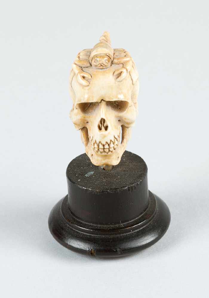 A Memento Mori in Manieristic manner of a skull with scorpion on top; very fine carving on bone,