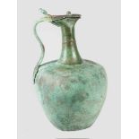 A bronze wine jug in ancient style with round body and thin long neck, one lid with hand grip ending