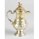 A small German Rococo silver coffee or chocolate pot, in shaped and bowed form with one spout and