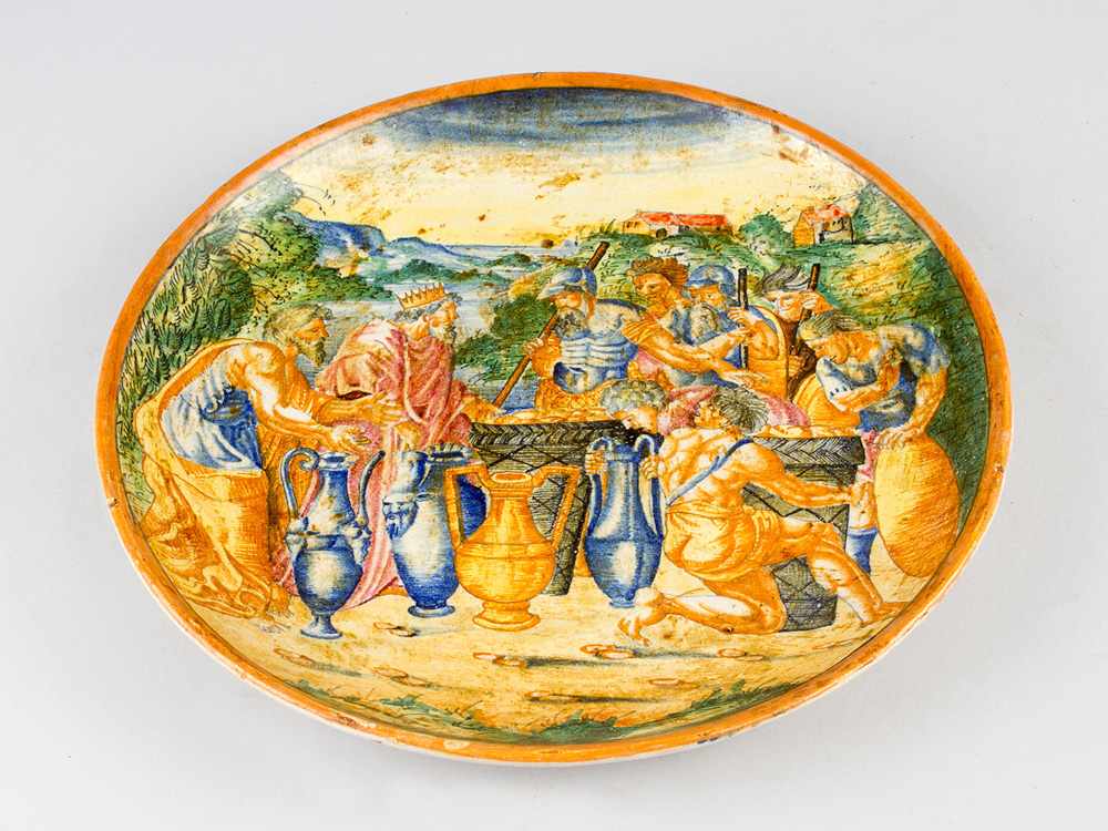 An Urbino ceramic dish, round shape, in the centre a painted classical historical scene with a