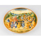 An Urbino ceramic dish, round shape, in the centre a painted classical historical scene with a