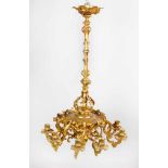 A charming small bronze chandelier with rare nine branches and lights; central column with round