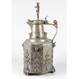 A large pewter guild tankard on three feet decorated as beasts, octagonal body, with rich achantus