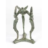 Bronze andiron in Roman style with three feet ending in winged beasts, in the centre minerva's