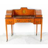 An elegant Sheraton-style ladie's writing desk, on four long concave legs on bronze wheels; kidney