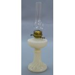 An opaque pearl white glass oil lamp.