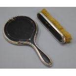 A hallmarked silver and tortoiseshell part vanity set mirror and brush.