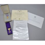 A Japanese 'Order of the Sacred Treasure' boxed medal together with a boxed USA star "For Gallantry