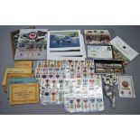 A mixed lot of militaria including military related cigarette cards, some contained in albums, FDCs,