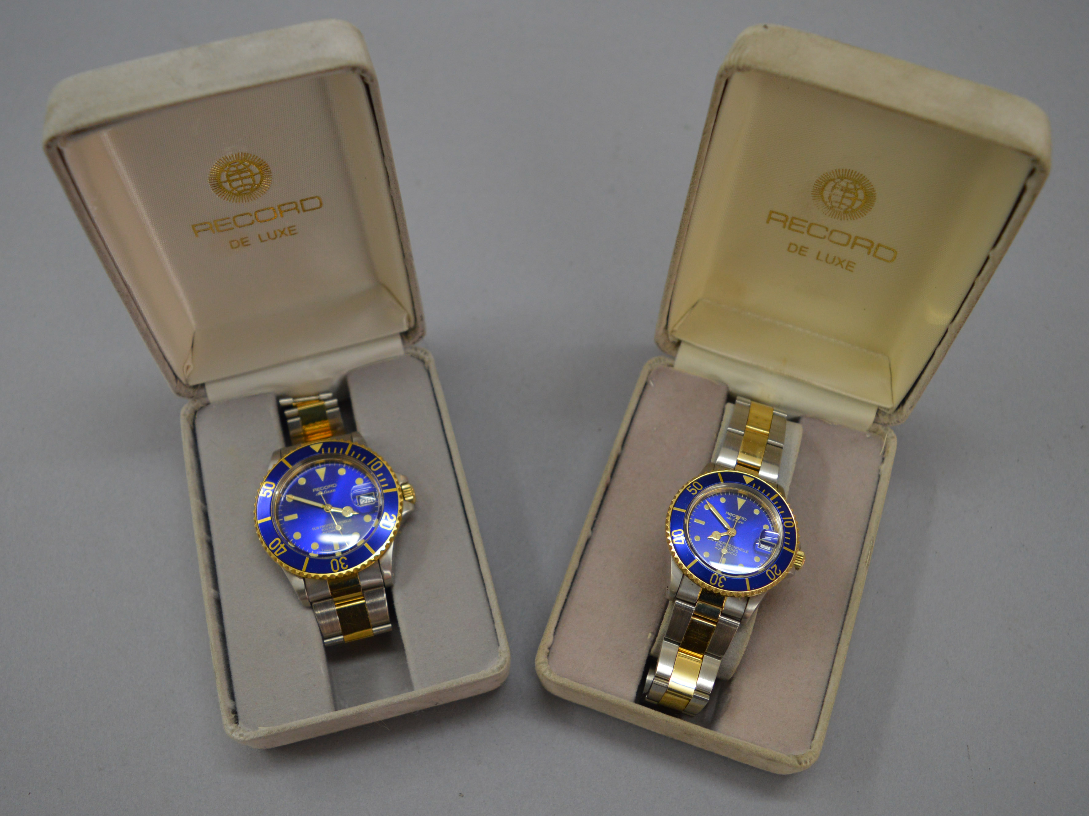 2 boxed Record De Luxe Sub Professionelle watches with boxes.