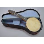 A vintage banjo with hard case