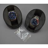 Two Citizen Eco Drive watches with part boxes.