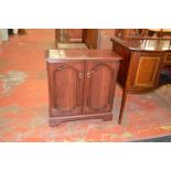 A reproduction mahogany 2 door cabinet