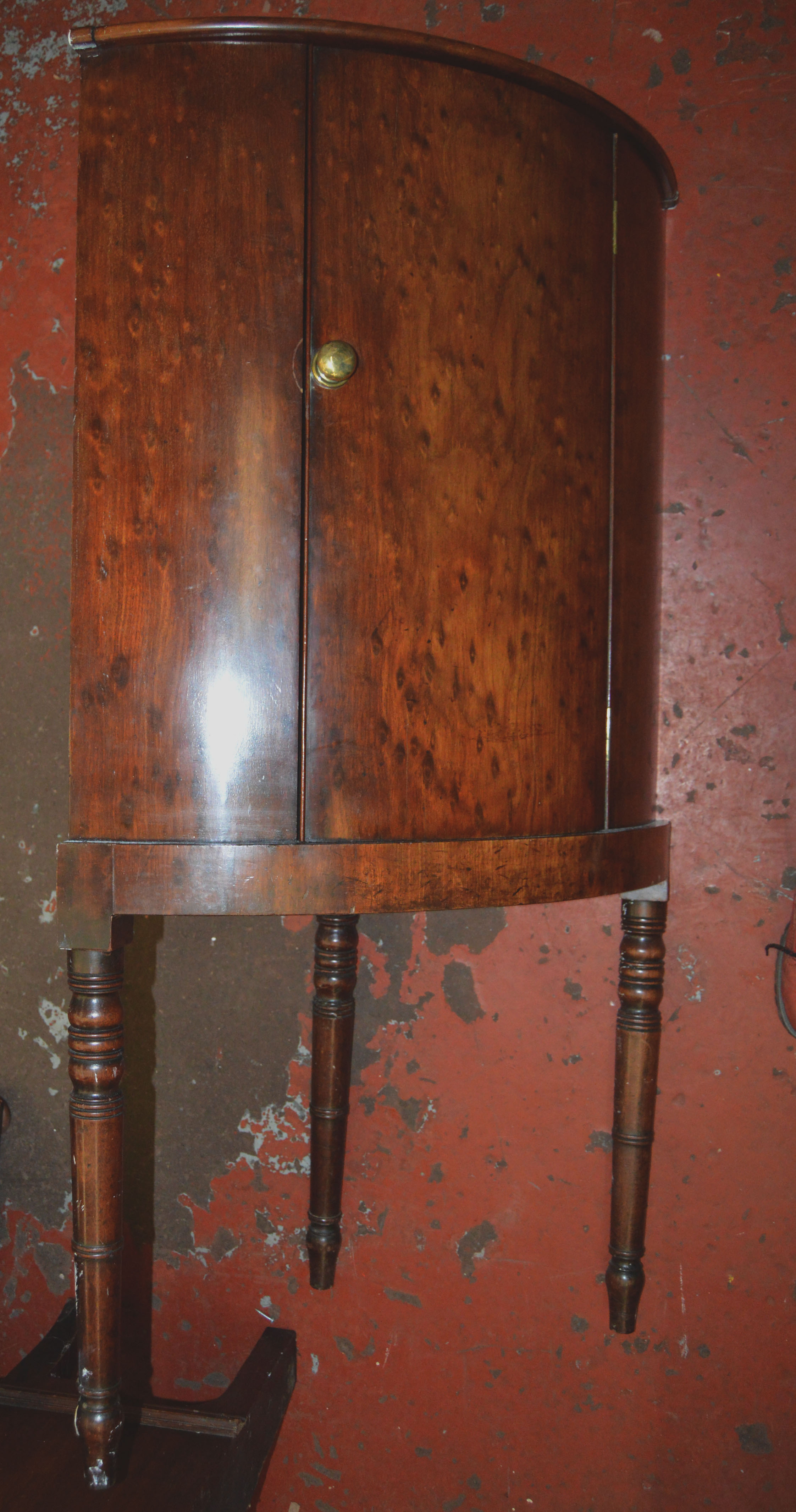 An Edwardian toilet mirror with carved supports together with a wall hanging cabinet and a corner