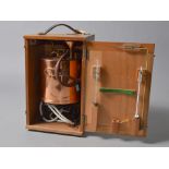 A copper laboratory still with wooden carry case and accessories by Holbek-Leba Limited.