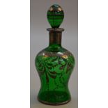 A vintage Italian glass decanter with silver overlay