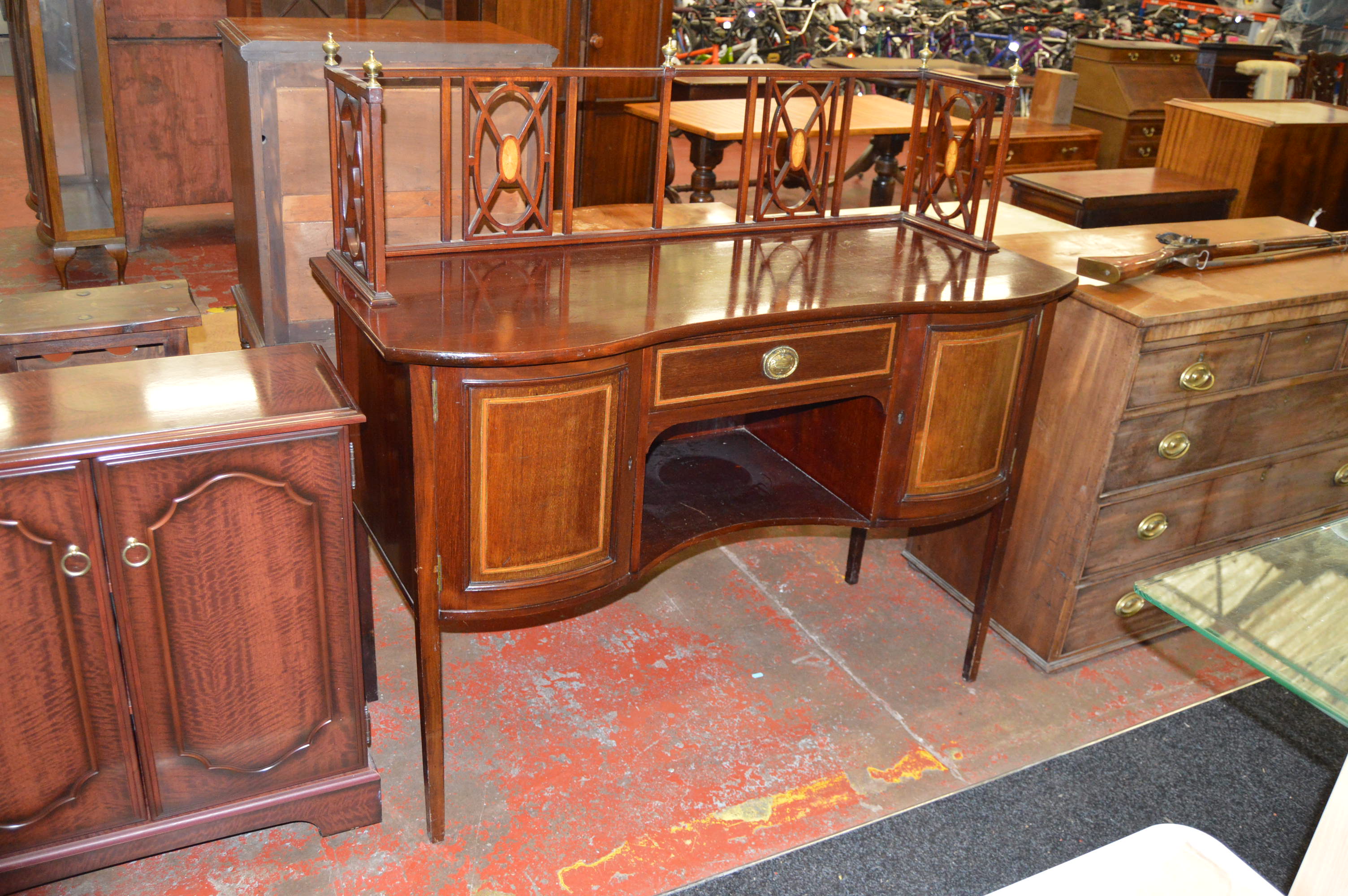 An Edwardian mahogany Buffet or serving table with gallery.