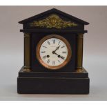 A black slate cased mantle clock, face marked "Alex Philip Edinburgh", movement marked "31452".