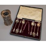 A set of Continental spoons marked "800" together with a hallmarked silver pierced bottle holder.