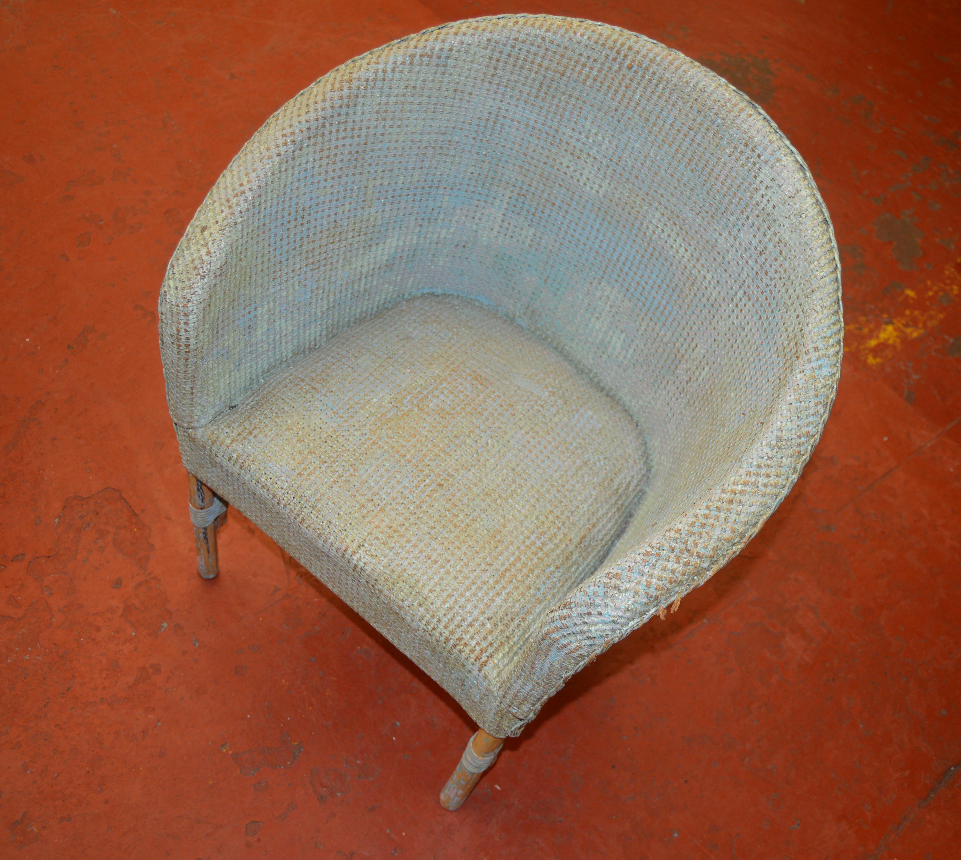 A childs Lloyd Loom style chair