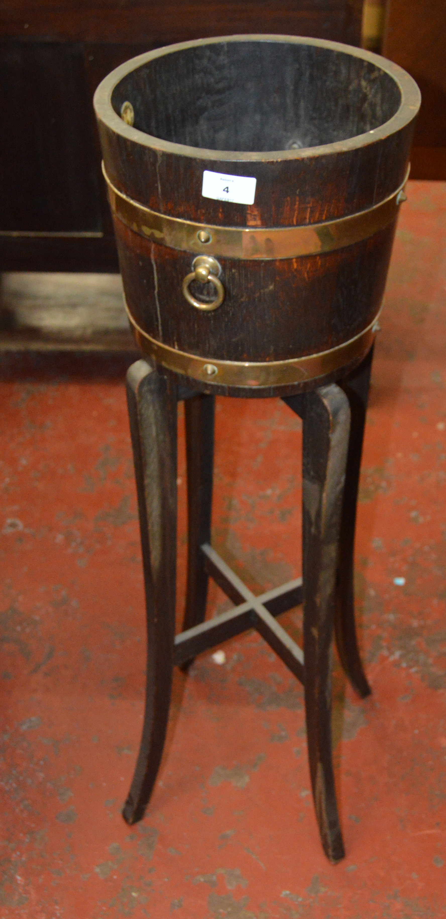 An oak hall planter with brass banding