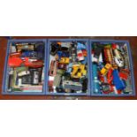 Three boxes of unboxed diecast model vehicles in a variety of different scales.