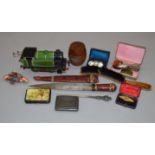 A mixed lot including a tinplate locomtive, 2 cased brooches,