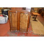 A bow fronted c1950's china cabinet